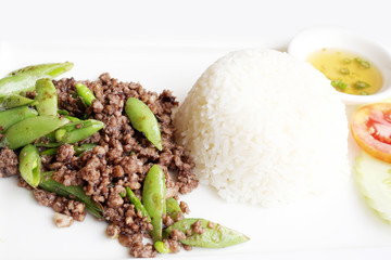 Fried pork with beans and rice.