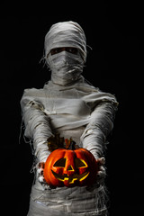 Studio shot portrait  of young man in costume  dressed as a halloween  cosplay of scary mummy pose...
