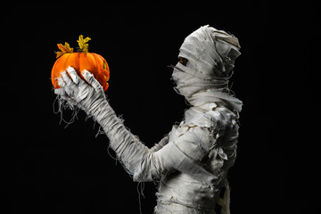 Studio shot portrait  of young man in costume  dressed as a halloween  cosplay of scary mummy pose...