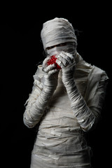 Studio shot portrait  of young man in costume  dressed as a halloween  cosplay of scary mummy pose...