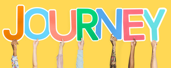 Diverse hands holding the word journey