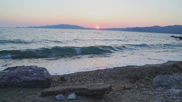 Beautiful waves of mediterranean sea during sunset near hisaronu, marmaris