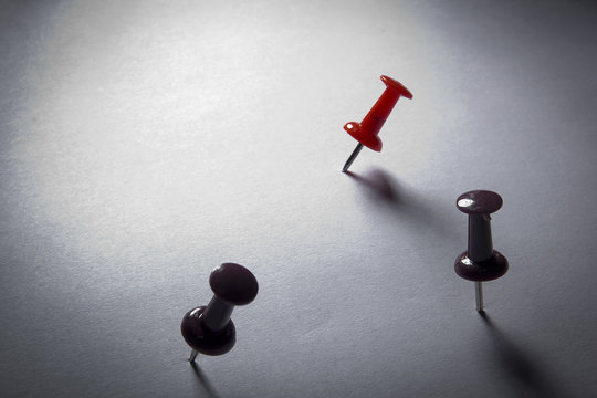 Pins stuck into the paper