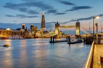 View of the river Thames in London after sunset with the Tower Bridge and the Shard in the back © elxeneize