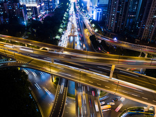 Fototapeta na wymiar The traffic on the crossroad at night in Guangzhou