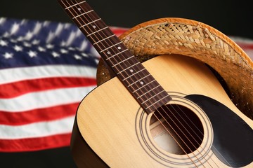 Acoustic guitar close up on background