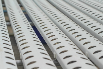 Close up white steel pipe with hole patterns in hydroponics planting System