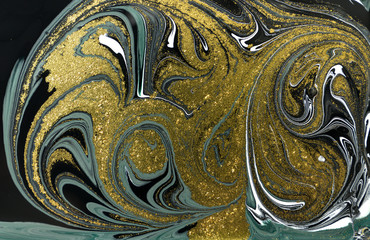 Gold marbling texture design. Blue and golden marble pattern. Fluid art.