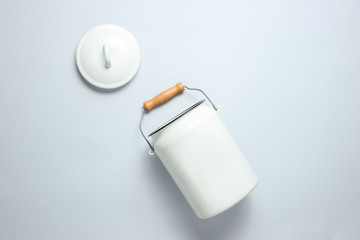 White enameled milk can on a gray background. Top view.