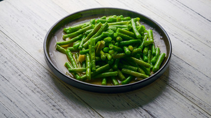 Fried long kidney beans on a plate