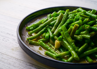 Fried long kidney beans on a plate