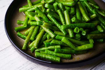 Fried long kidney beans on a plate
