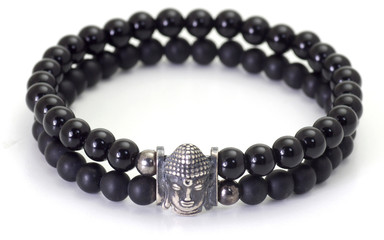 Black onyx bracelet with silver Buddha face figurine, isolated on white background