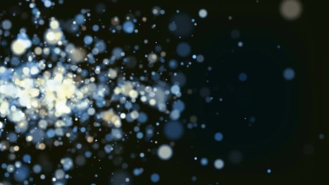 Gold and blue particles sparkles flying on black background. Holidays abstract animation.