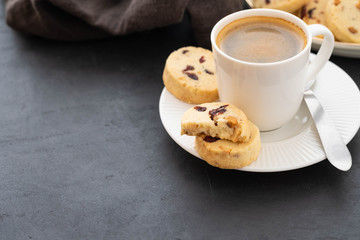 Closeup of cookies and a cup of coffee. Symbolic image. Concept for a tasty snack. Sweet dessert. Selective focus. Close up.