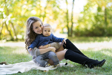 Fototapeta premium mother with baby in autumn park