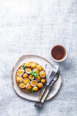 Toasted bread with quail egg and onion for breakfast, copy space