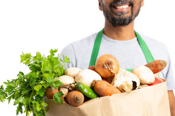 Close-up of grocery bag held by store employee.