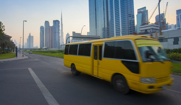 Dubai city downtown and bus moving on the road