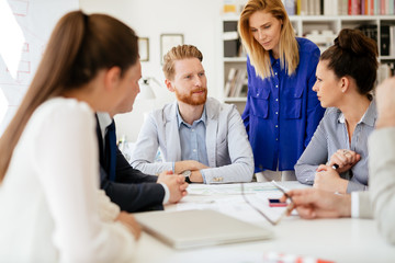 Group of business people working as team in office