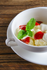 Healthe breakfast - lazy dumplings with sour cream and strawberry jam