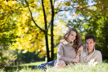 Fototapeta premium Young couple in autumn park