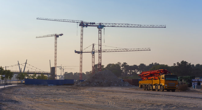 construction cranes and truck with concrete pump