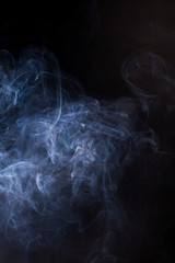 Smoke on a black background.