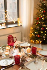 christmas, holidays and eating concept - table served for festive dinner at home