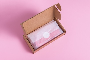 Carton gift box ob pink background