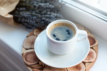 Cup of coffee on window sill, no people