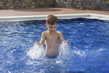 little boy in swimming pool