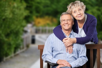 Close-up portrait of an elderly couple hugging