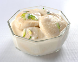 Rasmali, A sweet, yummy & cold dessert,  with cottage cheese dumpling dip in thickened cold milk.