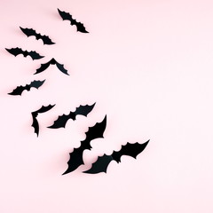 Halloween decorations concept. Halloween bats on pastel pink background. Flat lay, top view, copy space 