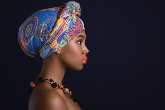 African woman with a colorful shawl on her head