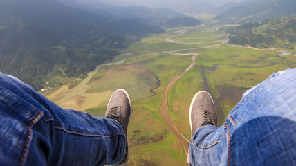 Legs straight out during paragliding