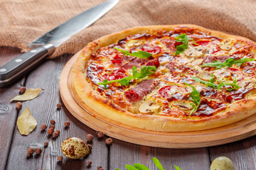 Delicious fresh pizza served on wooden table