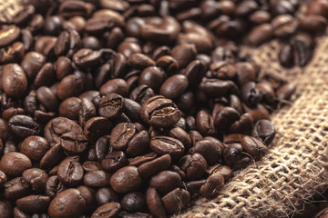 Roasted coffee beans on a wooden floor