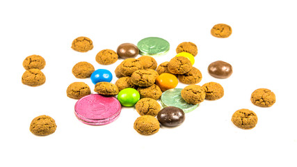 Bunch of pepernoten cookies, sweets and chocolate money frontal view