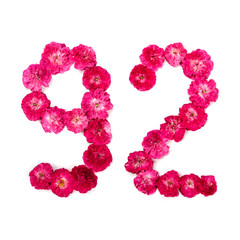 number 92 from flowers of a red and pink rose on a white background. Typographical element for design. Flower numbers, date, isolate, isolated