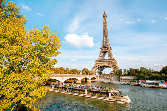 View on the Eiffel tower on Seine river during the autumn in Paris