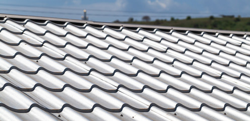 Light gray metal tile roofing, close-up