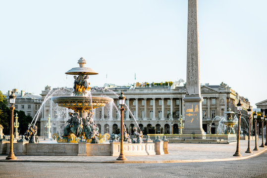 Maritime fountain on Concordia square with Luxor Obelisk on the background during the morning light in Paris