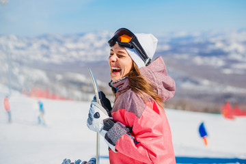 cheerful woman snowboarder laughs