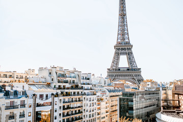 Beautiful cityscape view with residential buildings and Eiffel tower during the daylight in Paris