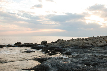 Fototapeta na wymiar Rocks and sea. Dramatic scene. Composition of nature.