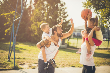 Little player on mother shoulders.