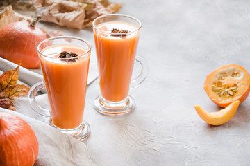Fresh pumpkin smoothie or juice. Autumn, fall or winter hot drink. Cozy healthy beverage.