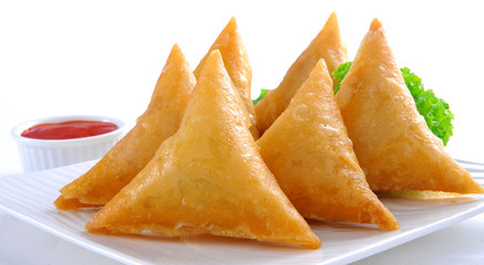 Samosa, Sambusa, Samboksa with a   savory filling of chicken, mince, potato & vegetables